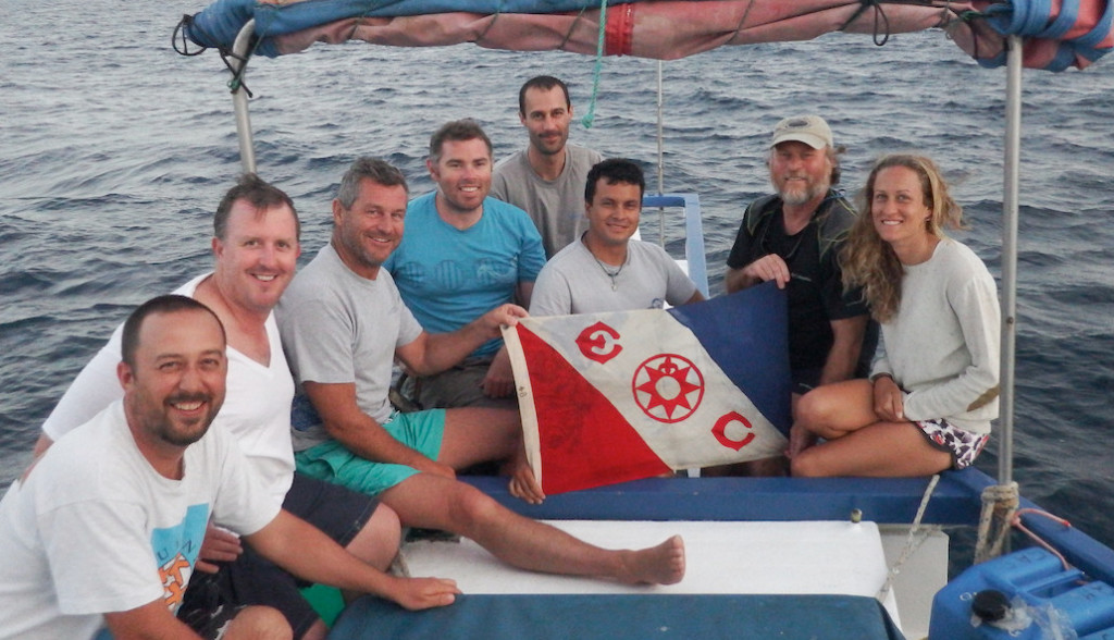 The research team pose with the Explorerâ€™s Club Flag. From left to right: Dr. Alex Hearn, Dr. Alistair Dove, Jonathan Green, Dr. Simon Pierce, Dr. Chris Rohner, Leandro Vaca, Dr. Brent Stewart, Clare Prebble. Photo: Brent Stewart.
