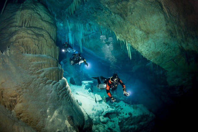 Three cave divers join Jill during an underwater filming project.