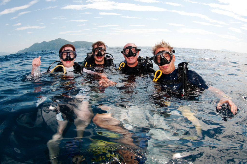 group of friends on surface before dive