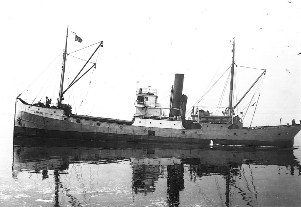 The freighter Vamar on a flat, calm sea (Photo Courtesy of the National Archives)