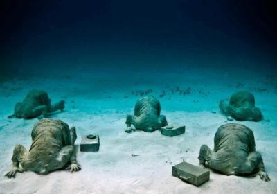 The Bankers sculpture by Jason deCaires Taylor Cancun Underwater Museum