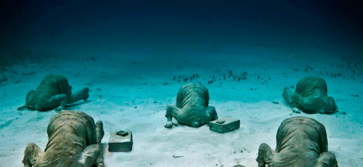 The Bankers sculpture by Jason deCaires Taylor Cancun Underwater Museum