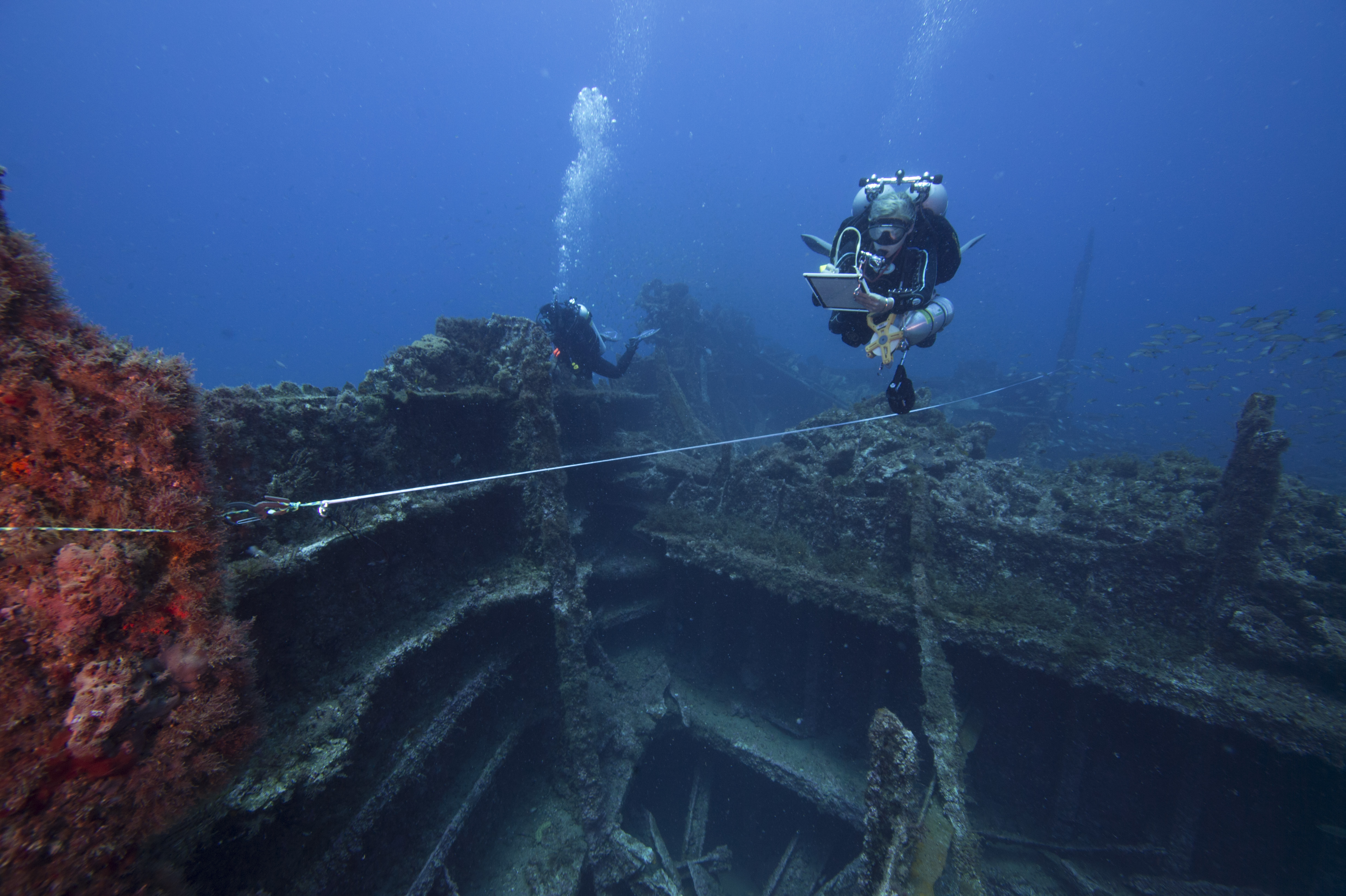 A diver documents the wreck of Dixie Arrow off the coast of North Carolina. (Photo credit: Joe Hoyt/NOAA)